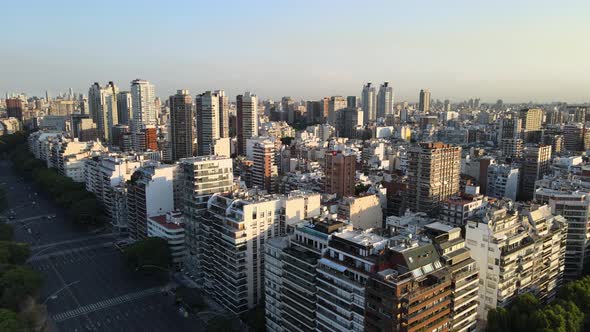 Dense urban Palermo Libertador Avenue Buenos Aires urban high rise skyline aerial dolly left