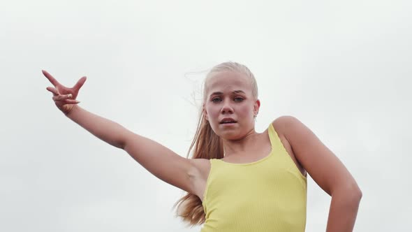 Woman Dancing In Yellow On Bus