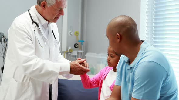 Male doctor examining patient