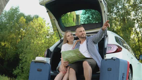 Happy Couple Traveling By Car