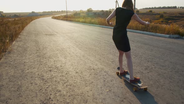 Woman Is Walking on a Longboard While Moving, Tricks, Sports, 