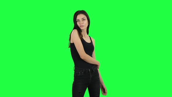 Young Girl Posing at the Camera. Green Screen