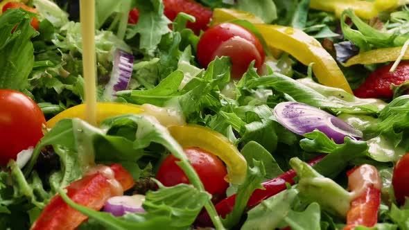 Dressing Poured On Fresh Salad