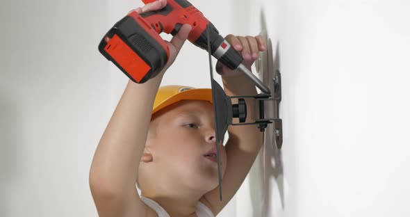 Boy Working with Electric Screwdriver