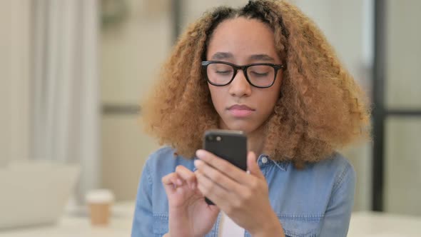 Portrait of African Woman Using Smartphone