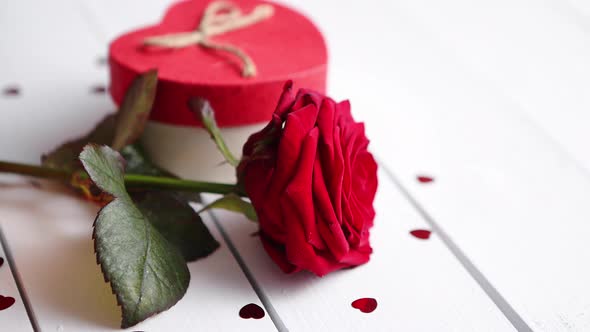 Fresh Red Rose Flower on the White Wooden Table