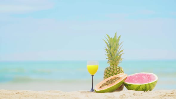 Fruits on the Sea Background. Beautiful Fruit Cocktail Drink on Beach