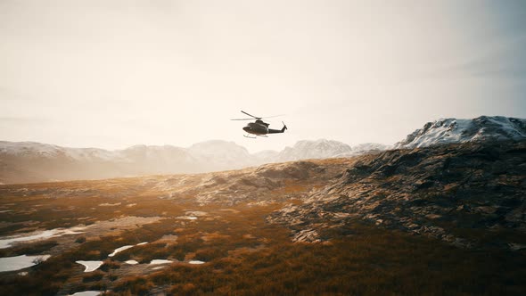 Slow Motion Vietnam War Era Helicopter in Mountains alt