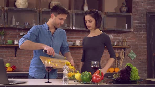 Wife and Husband Cook Evening Meal in Flat