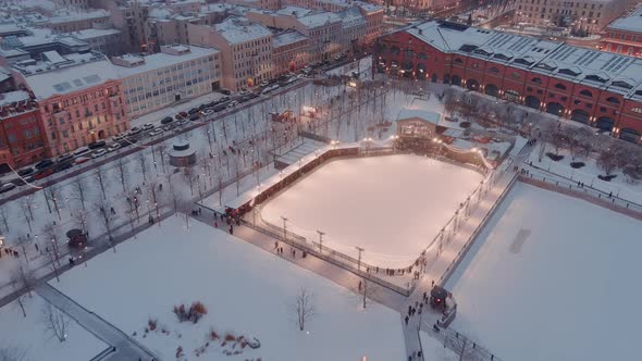 Aerial View of the New Holland Park in a Snowy Winter Evening Night Illumination of Buildings and