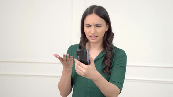 Angry Indian woman talking on a video call