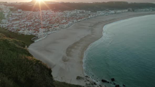 View From The Viewpoint Of Nazaré Beach At Sunrise In Portugal - aerial drone shot