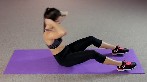 Thorough Young Woman Working Hard to Have Ideal Body, Doing Abdominal Crunches