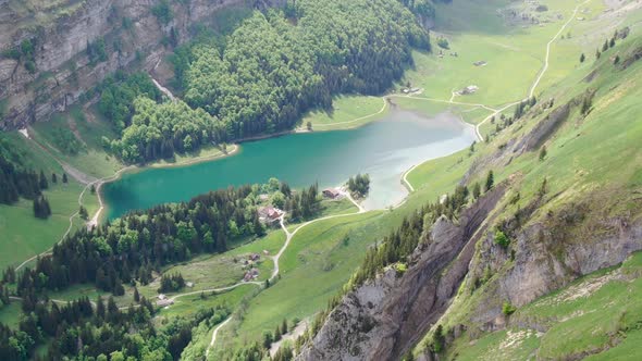 Drone shot of Seealpsee lake in the Alpstein range, Appenzell Alps, Switzerland