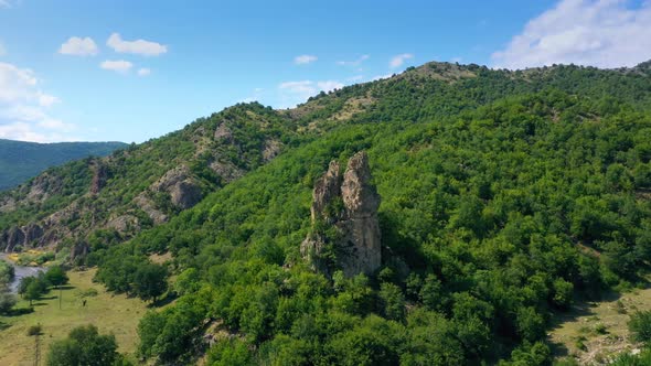 Drone Flight Over Steep Hill Towards The Summer Mountains