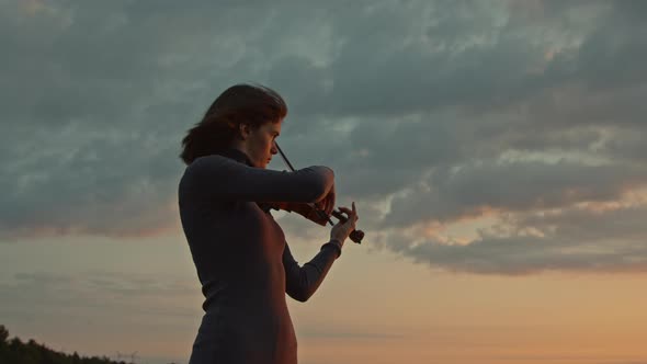 Woman Violinist Playing Solo Outside