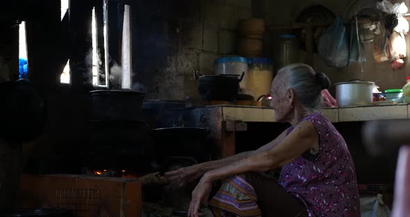 Senior Woman Chef Cooks In The Kitchen