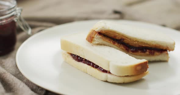 Close up of peanut butter and jelly sandwich in a plate