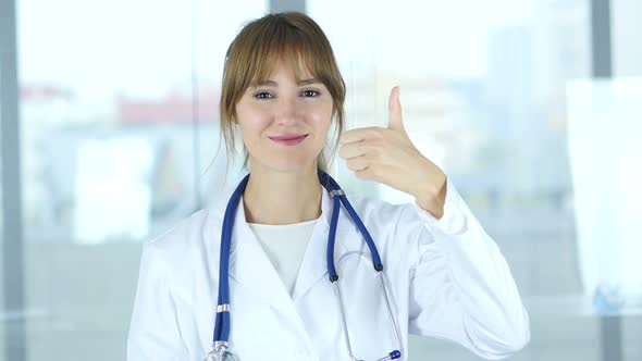 Portrait of Thumbs Up by Female Doctor in Clinic