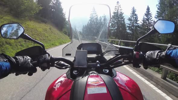 POV Biker Rides on Motorbike By Scenic Green Mountain Road Swiss Alp Moto Trip