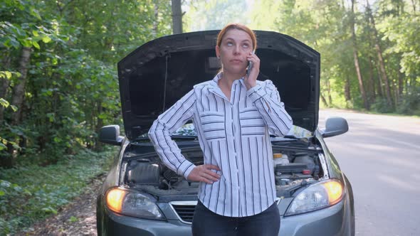 Business Woman at the Background of Broken Car in the Forest