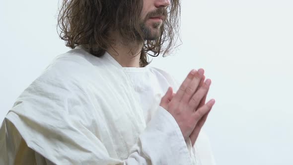 Holy Man in White Robe Praying God Asking for Healing and Blessings of People