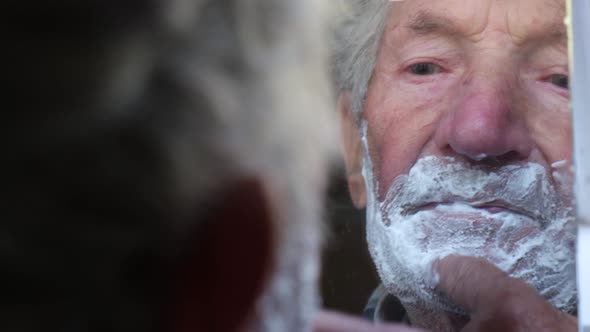 Grandpa Shaves Near the Mirror He Smeared His Face with White Foam