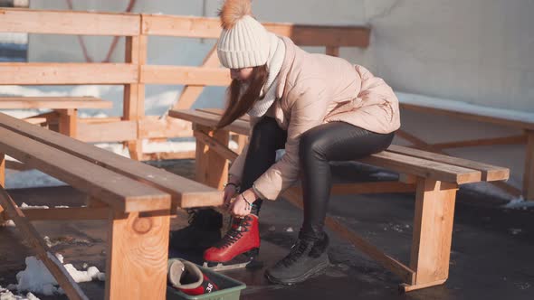 Young Woman Preparing Skating