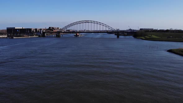 Calmness Of A River Under The Bridge With Ship Sailing In Noord River At Hendrik-Ido-Ambacht In Neth