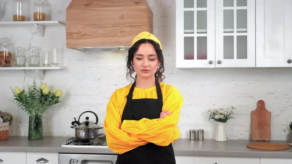 Portrait Serious Housewife Crossing Hands Looking Camera in Home Modern Kitchen