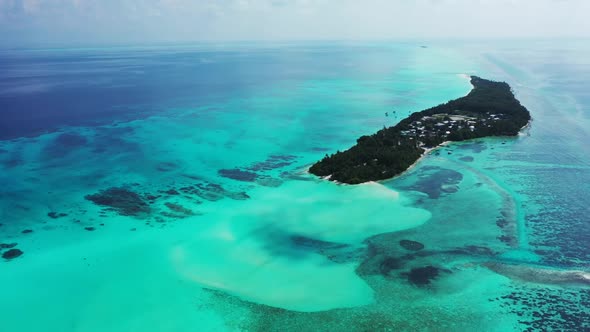 Aerial flying over scenery of paradise resort beach lifestyle by turquoise sea with clean sandy back