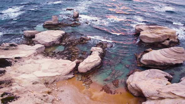 Nature Aerial Landscape Over the Ocean at Sunset or Sunrise Sea Waves on the Unusual Rocky Coast