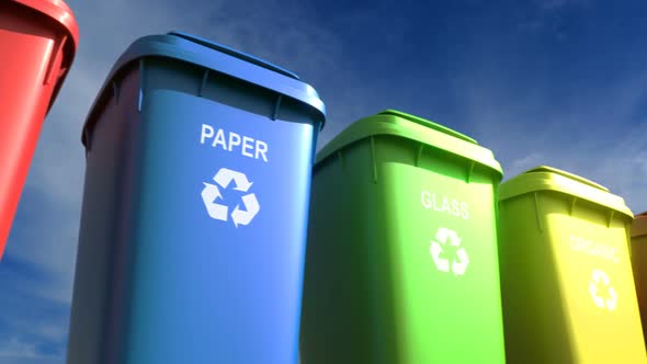 Multi-colored Plastic Garbage Bins with Waste Type Labels and Recycle Logos Loop