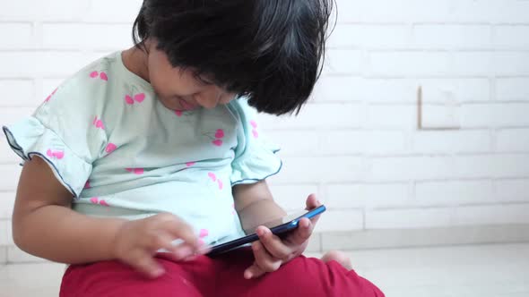 Child Girl Watching Cartoon on Smart Phone