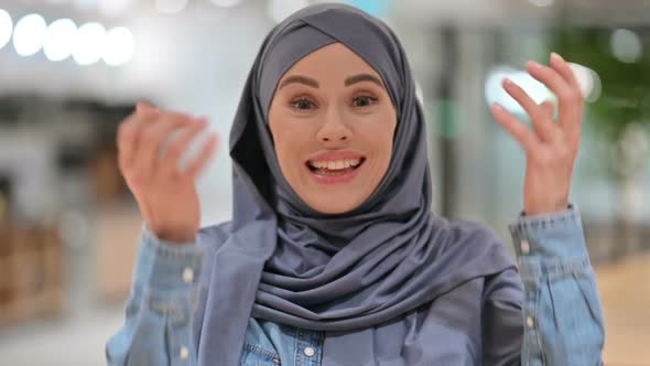 Excited Arab Woman Celebrating Success Cheering