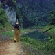 Cute Smiling Asian Girl Walking on a Trail in Cheow Lan Lake Thailand - VideoHive Item for Sale