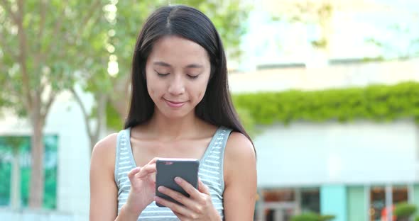 Asian woman using mobile phone 