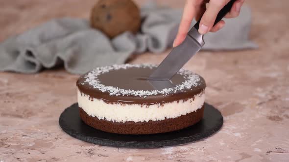 Delicious chocolate cake sprinkled with coconut on top.