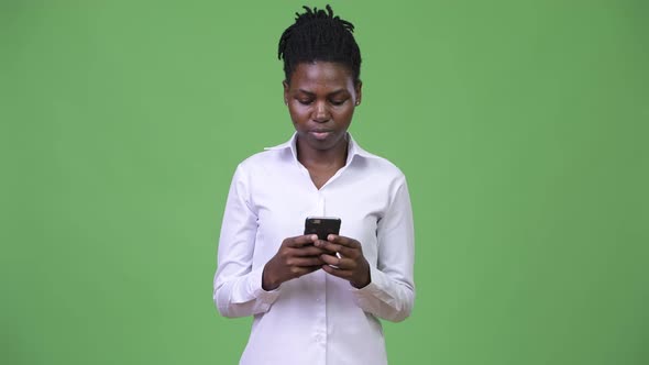 Young Beautiful African Businesswoman Using Phone