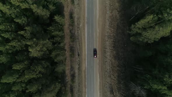 Top down aerial view of asphalt road in the forest 11