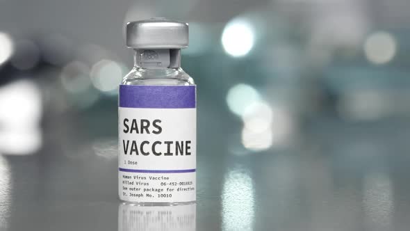 SARS vaccine vial in medical lab with syringe