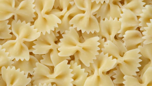 Italian pasta farfalle top view rotation