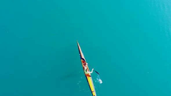 A kayaker paddles in a scenic mountain lake.