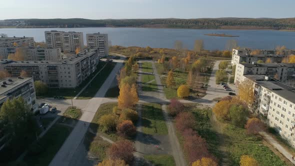 Aerial view of alley near the pond in a provincial autumn town 21