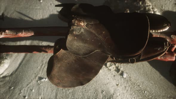 Rider Leather Saddle on Fence in Desert