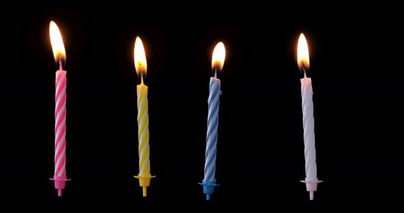 Collection pack of birthday candles isolated on black background, different flame is floating