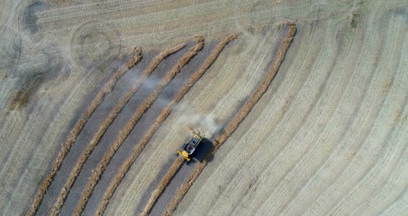 Combine harvester harvesting the crops in field 4k