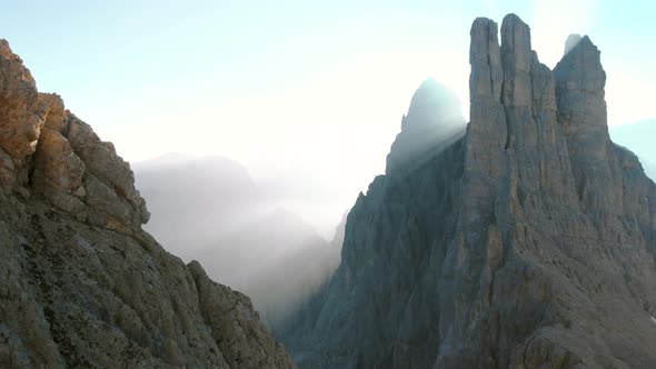 Flying Over Vajolet Towers mountain in Dolomites Italy at sunrise