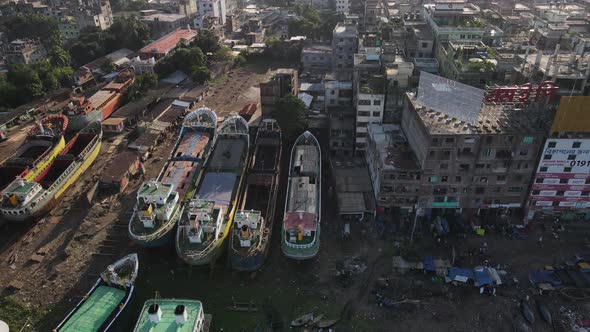 Ship wrecking dockyard beside a city in Asia. Aerial Shot