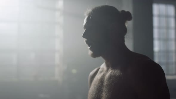 Exhausted Sportsman Standing in Sport Club